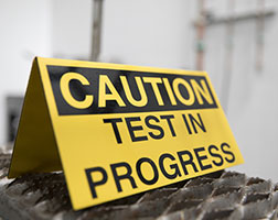 Image of a testing-in-progress sign.